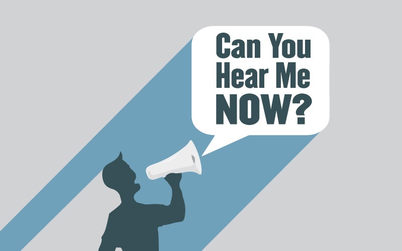 silhouette of man yelling into megaphone
