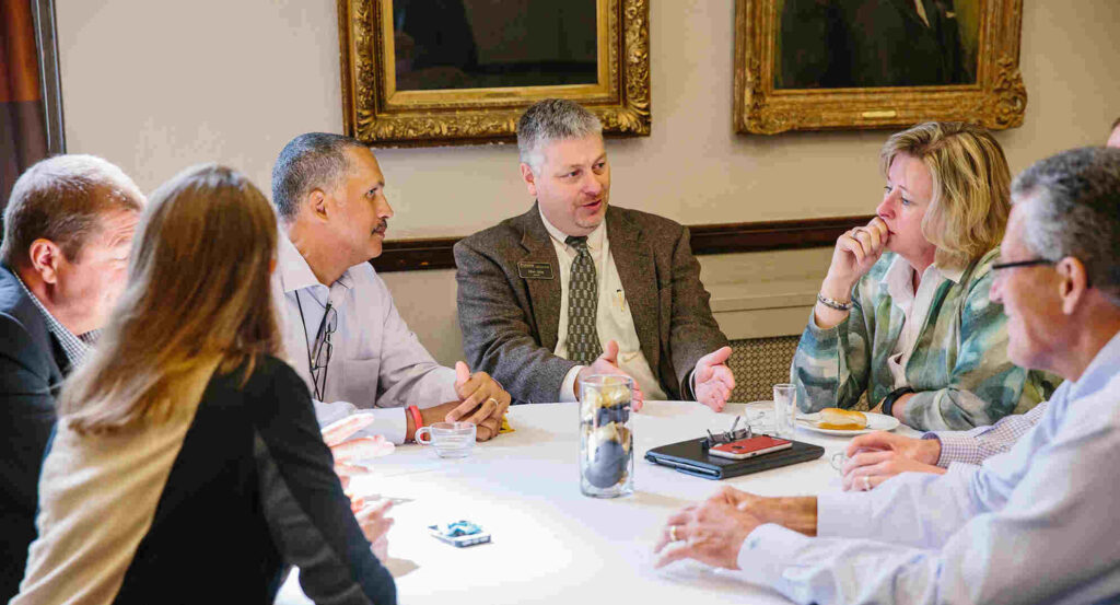 Group around table talking