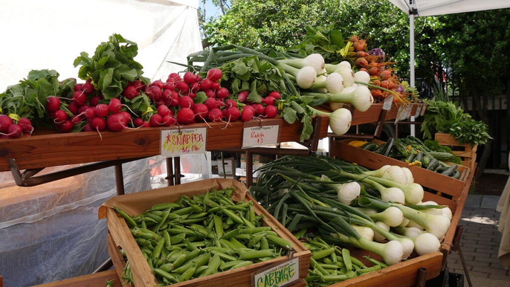 produce displayed at a local farmer's market stand