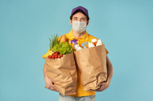 man carrying groceries
